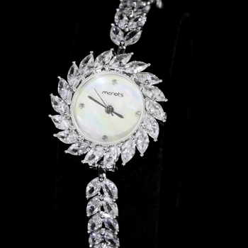 A luxurious watch with an elegant and distinctive design, plated with gold and adorned with zircon stones