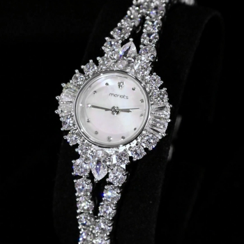 A luxurious watch with an elegant and distinctive design, plated with gold and adorned with zircon stones