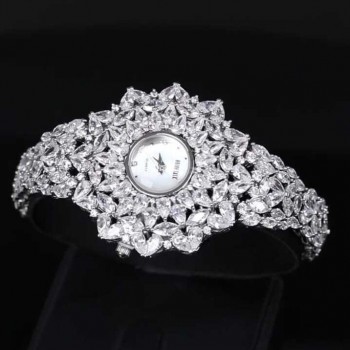 A luxurious watch with an elegant and distinctive design, plated with gold and adorned with zircon stones